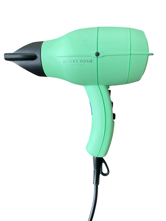 Left side view of the Harry Josh Pro Dryer 2000 showing slim profile and nozzle attachment